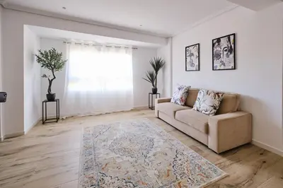 a living room with a couch and a rug at Carmen flat in Valencia