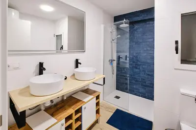 a bathroom with two sinks and a shower at Carmen flat in Valencia