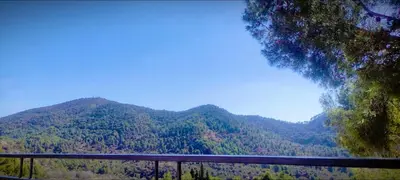 a view of a mountain with a fence in front of it at Apartamento en la montaña, Serra in Serra