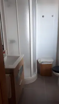 a bathroom with a shower and a sink and a toilet at Neo Mediterráneo in Barrio-Mar