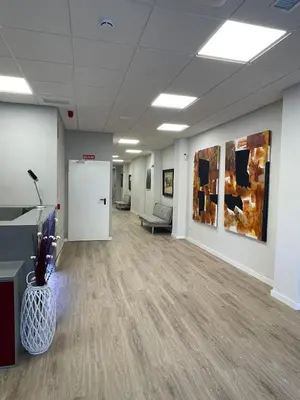 an empty office lobby with a couch and a table at Unicorn Residence for students New Opening 2024 in Valencia