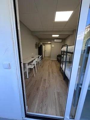 an empty room with a table and a bed at Unicorn Residence for students New Opening 2024 in Valencia