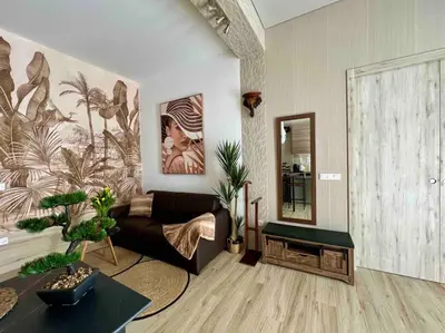a living room with a couch and a mirror at Casa Maravillosa in Valencia