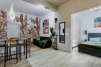 a bedroom with a bed and a dining room at Casa Maravillosa in Valencia