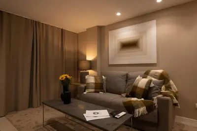 a living room with a couch and a table at Dorm4You Centro in Valencia