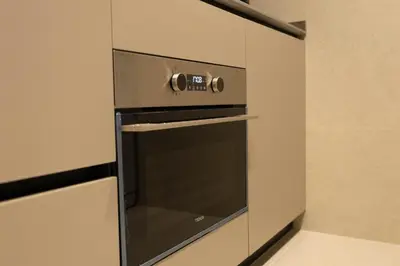a microwave oven in a cabinet in a kitchen at Dorm4You Centro in Valencia