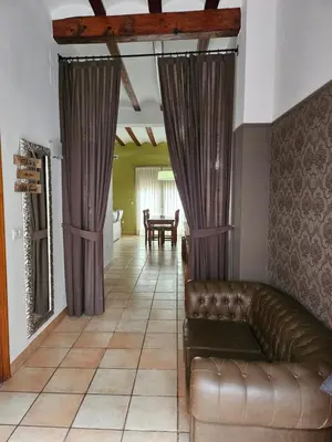 a living room with a couch and a table at Ca Vicent in Estivella