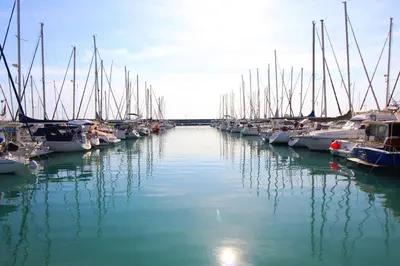 a group of boats docked in a harbor at Global Vacacional, Apartamento con piscina y terraza en la playa de Canet in Canet de Berenguer