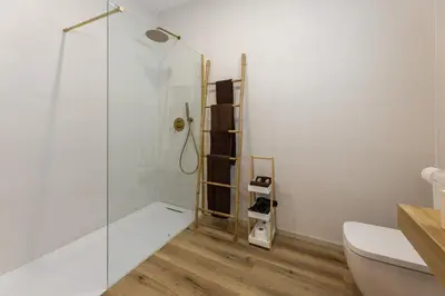a bathroom with a shower and a toilet at Pivote Flats - Marina B in Valencia