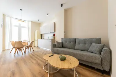 a living room with a couch and a table at Pivote Flats - Marina A in Valencia