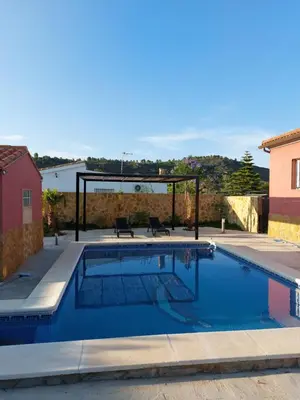 a swimming pool in the middle of a house at les berreries in Montroy