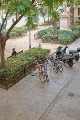 a group of bikes parked next to a park at Apartamento de diseño en la Plaza del Carmen F1 in Valencia