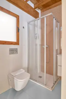 a bathroom with a shower and a toilet at Apartamento de diseño en Plaza del Carmen F4 in Valencia