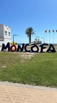 a large sign that says miami on the grass at Acogedor apartamento en la playa con WIFI y AACC in Moncófar
