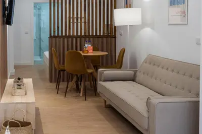 a living room with a couch and a table at VLC HOST - San Jacinto in Valencia