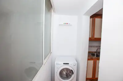 a washer and dryer in a bathroom with a shower at Precioso Apartamento en Valencia 2 dormitorios con Parking in Paterna