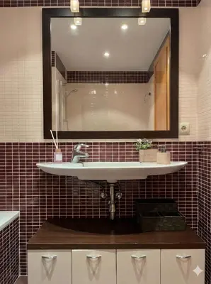 a bathroom with a sink and a mirror at Apartamento en primera línea de la playa a 15 minutos de la Ciudad de Valencia in Valencia