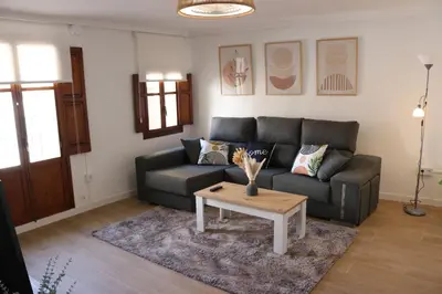 a living room with a couch and a coffee table at La Casa del Castell in Onda