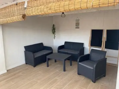 a waiting room with two chairs and a table at La Casa del Castell in Onda