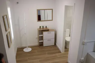 a bathroom with a sink and a mirror and a toilet at La Casa del Castell in Onda