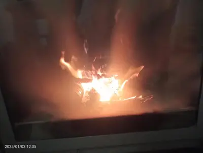 a television screen with a fire in the middle at Casa del Cerro in Eslida