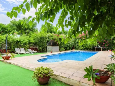 a swimming pool in a yard with plants at Holiday Home D'estiu by Interhome in El Grao