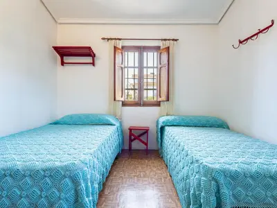 a room with two beds and a window at Holiday Home D'estiu by Interhome in El Grao