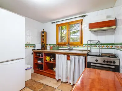 a kitchen with a sink and a stove at Holiday Home D'estiu by Interhome in El Grao