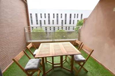 a table and two chairs on a balcony with a table at MUY BIEN SITUADO LAS CIENCIAS n in Valencia