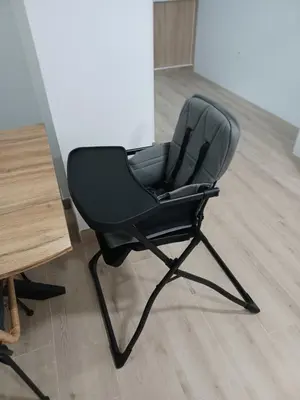 a black office chair sitting next to a table at Apartamento Turístico en Valencia in Valencia