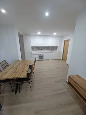 a large room with a wooden table and chairs at Apartamento Turístico en Valencia in Valencia