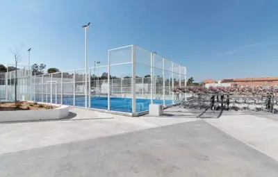 a large glass building with a pool in front of it at Espectacular apartamento en Gran cannet in Canet de Berenguer