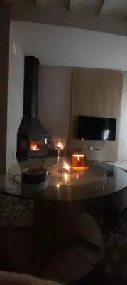 a kitchen with a stove with candles on a table at Casa rural Puchero y Manta in Alcudia de Veo