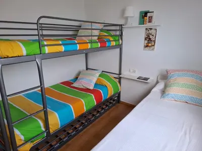 a bunk bed room with two bunk beds next to each other at 3 Bed Chalet-Pool-Pets-Hot Tub-Parking-Garden in Chiva