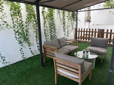 a small kitchen with white cabinets and an oven at 3 Bed Chalet-Pool-Pets-Hot Tub-Parking-Garden in Chiva