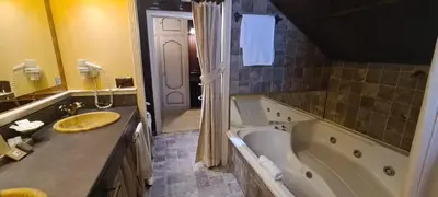 a large bathroom with a tub and a sink at Masía De Lacy in Museros