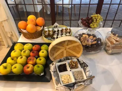 a table with a bunch of fruits and other foods at Masía De Lacy in Museros
