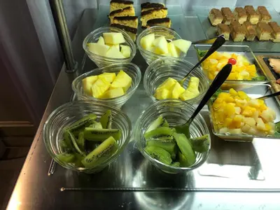 a bunch of bowls of fruit and vegetables on a counter at Masía De Lacy in Museros