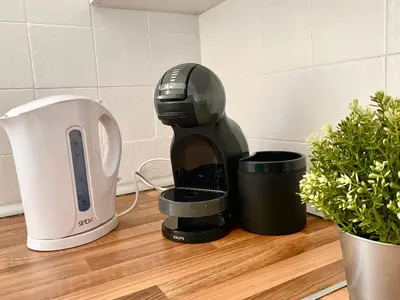 a coffee maker sitting on a counter next to a cup at Mi Oasis Azul Parking, AC, Fibra, VT-54949-V in Sueca