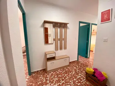 a bathroom with a vanity and a mirror in a room at Mi Oasis Azul Parking, AC, Fibra, VT-54949-V in Sueca