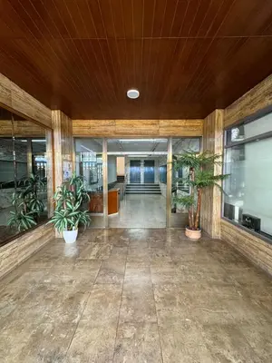 an empty lobby with potted plants in a building at precioso apartamento a 10 metros de la playa in Cullera