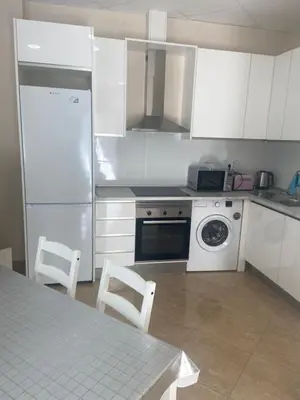 a kitchen with a white refrigerator and a dishwasher at Casa Valencia in Valencia