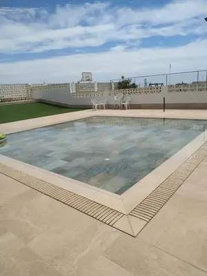 a swimming pool on the roof of a building at Desconexión y Relax in Mareny Blau