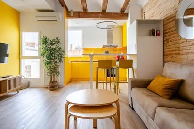 a living room with a couch and a table at Espectacular y luminoso apartamento en el centro in Valencia
