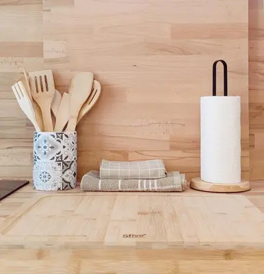 a kitchen with wooden utensils and a roll of paper towels at Loft Céntrico - The Essence by ValeciaGOapartments in Valencia