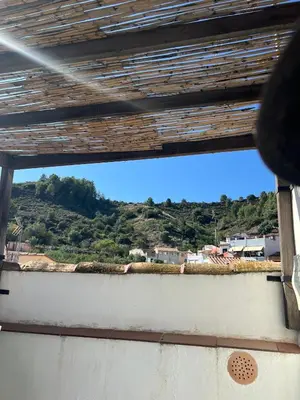 a view of a mountain from a window at La Casita de Las Estrellas in Algimia de Almonacid
