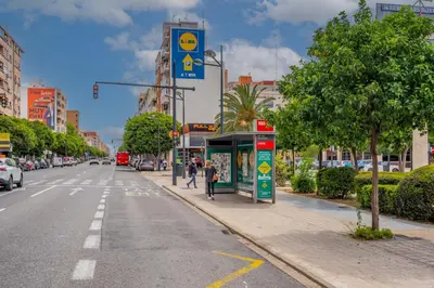 a street with a bus stop on the side of the road at Mediterraneum Suite F in Valencia