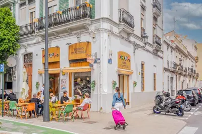 a group of people walking down the street with luggage at Mediterraneum Apto E in Valencia