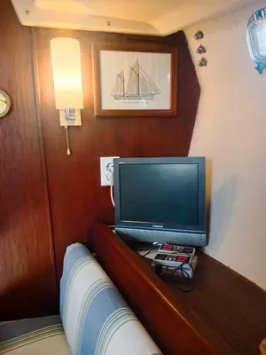 a tv on a wooden shelf in a room at Velero Valencia Whimsy in Valencia