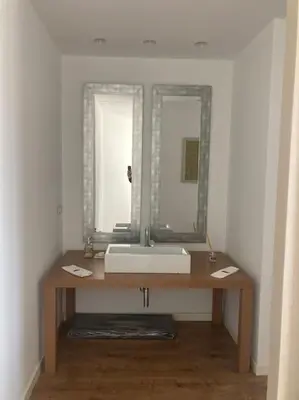 a bathroom with a sink and a mirror at molino rehabilitado con gran terraza y piscina in Paterna